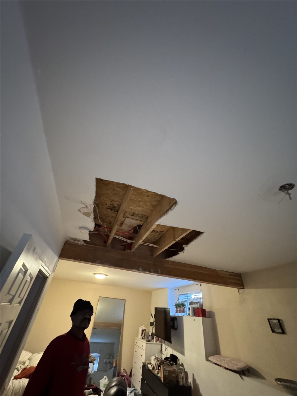 Damaged ceiling prepped for drywall patching